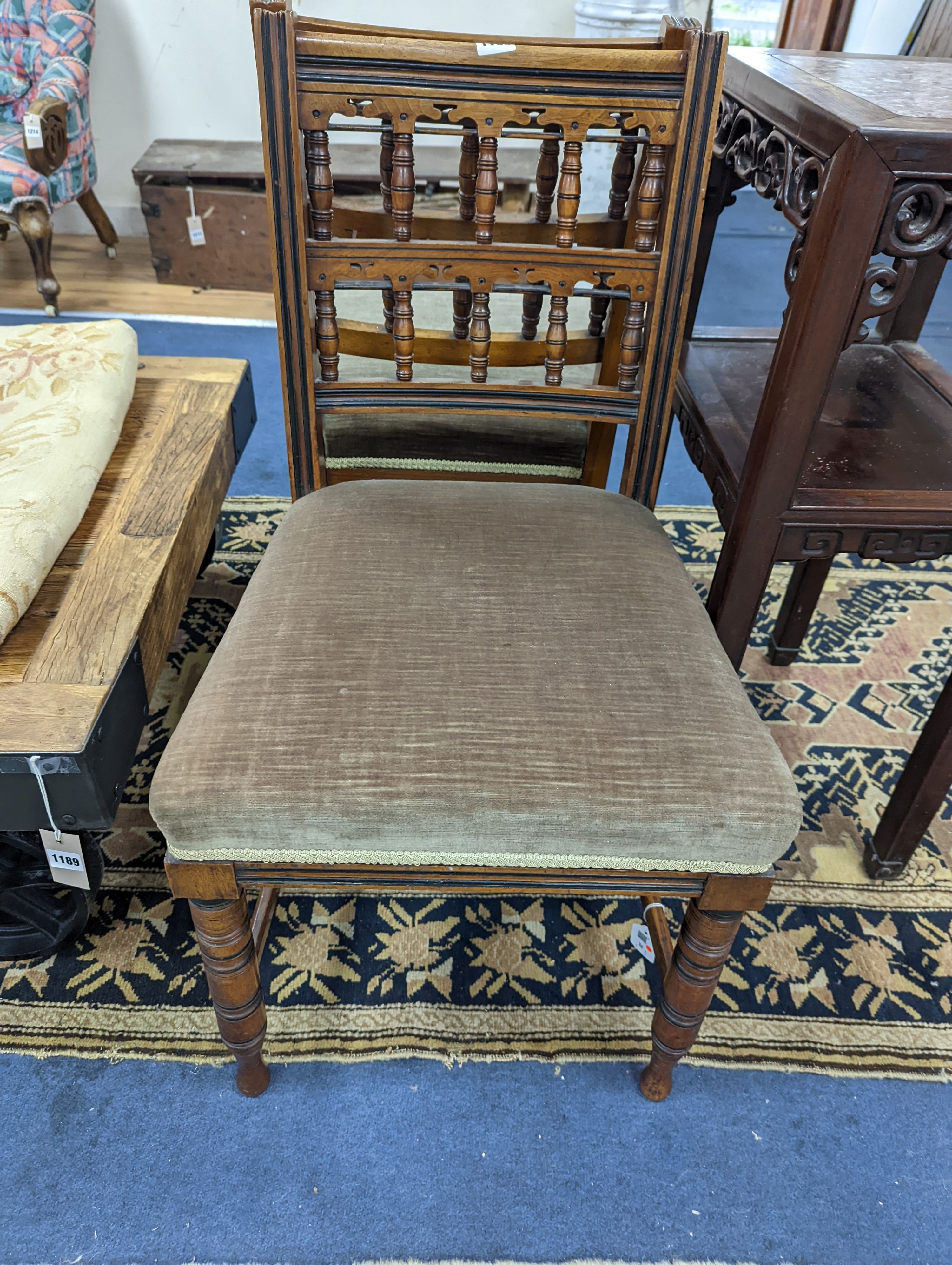 Bruce James Talbert (1838-1881) for James Lamb, Manchester, a pair of Aesthetic movement walnut side chairs, width 44cm, depth 48cm, height 82.5cm